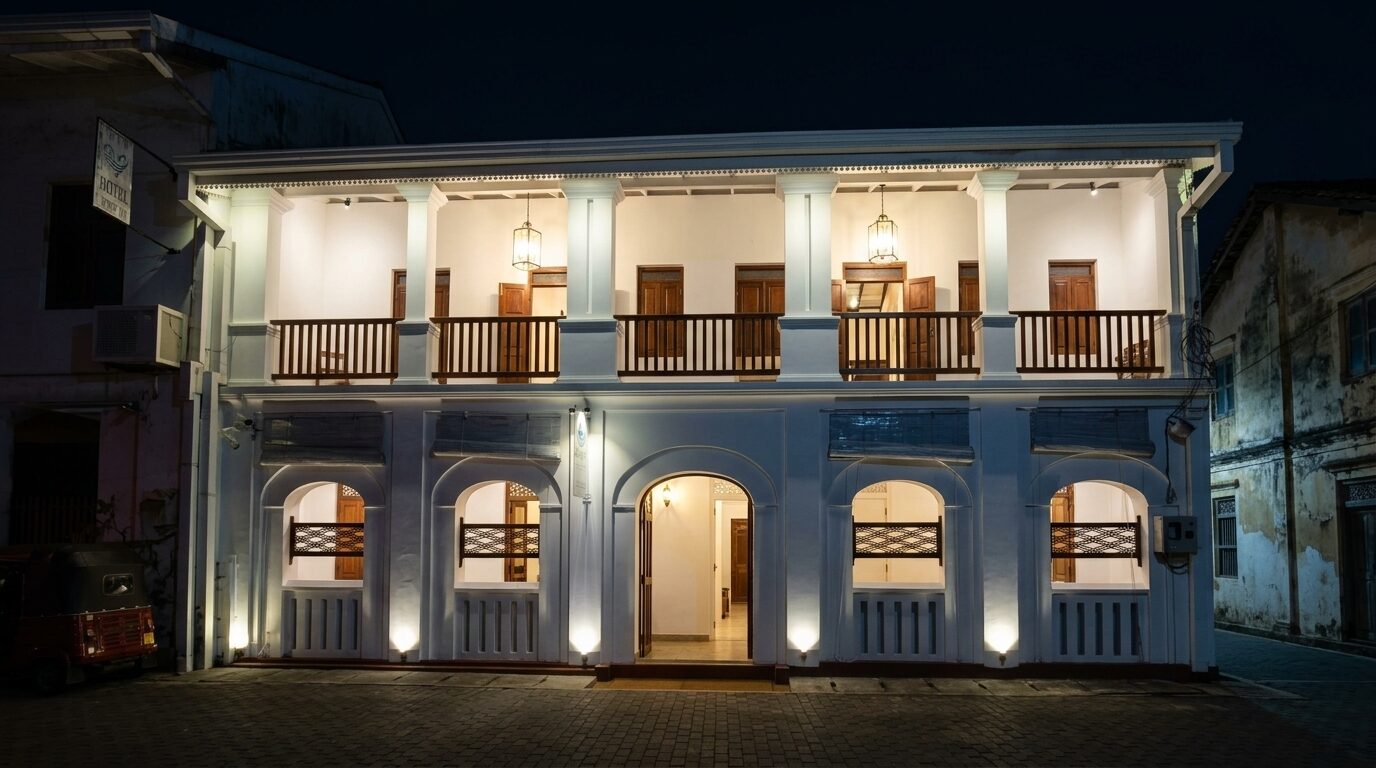 Zeegolf Hotel at night — lit arches and verandah, Galle Fort