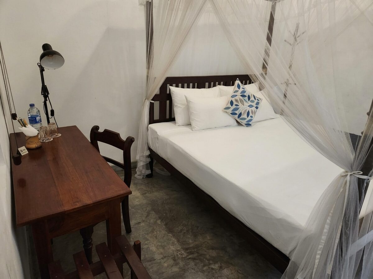 Fort Room — canopy bed and teak writing desk